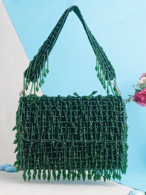 An elegant green color flap clutch bag