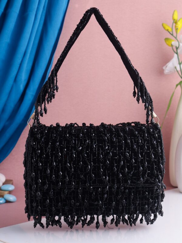 An elegant black color flap clutch bag
